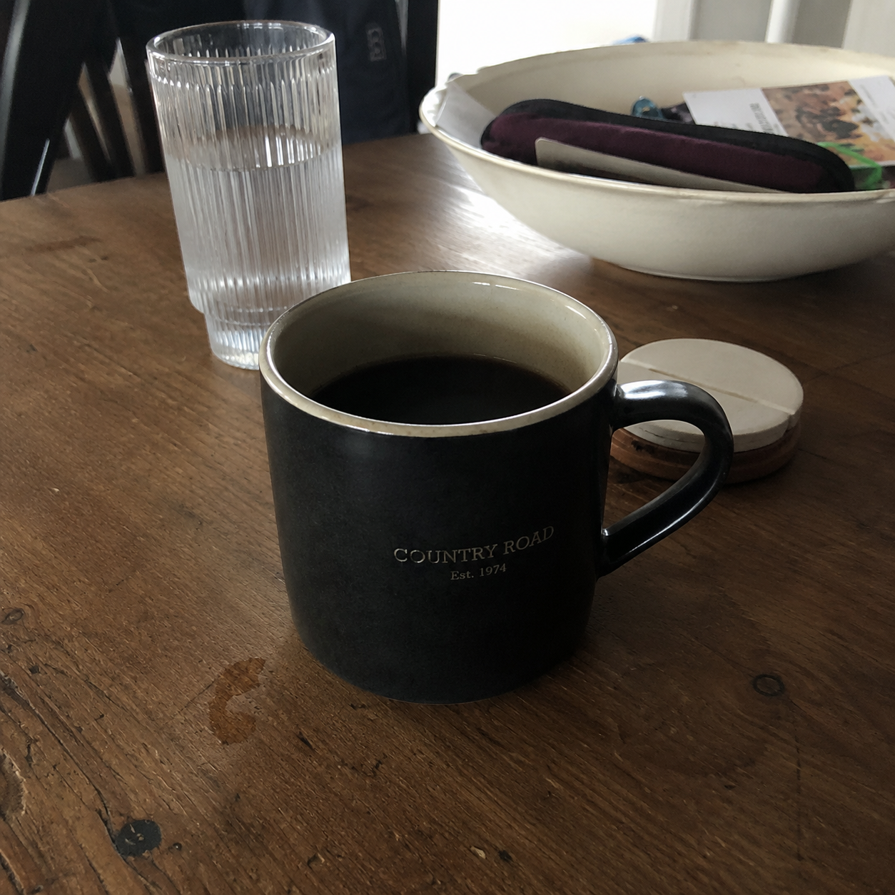 Morning coffee with RISE on a wooden table